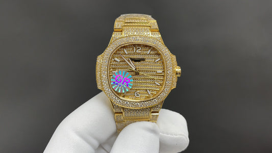 Patek Philippe Nautilus 7010 – “Gold Iced Out” (aftermarket).
