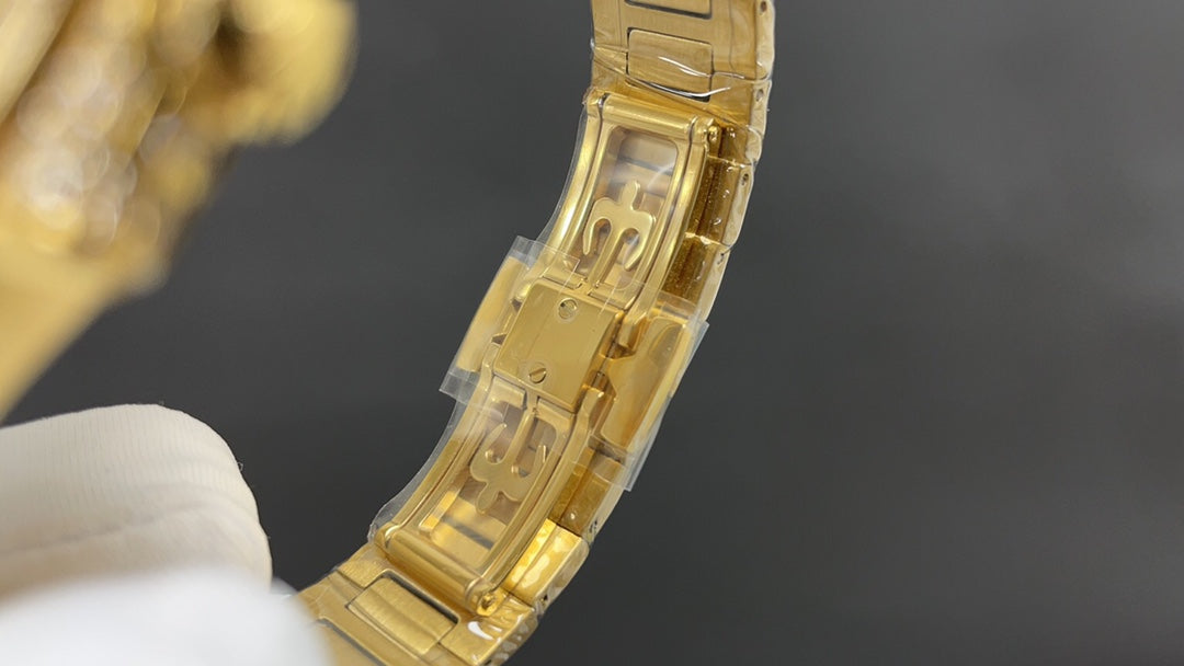 Patek Philippe Nautilus 7010 – “Gold Iced Out” (aftermarket).