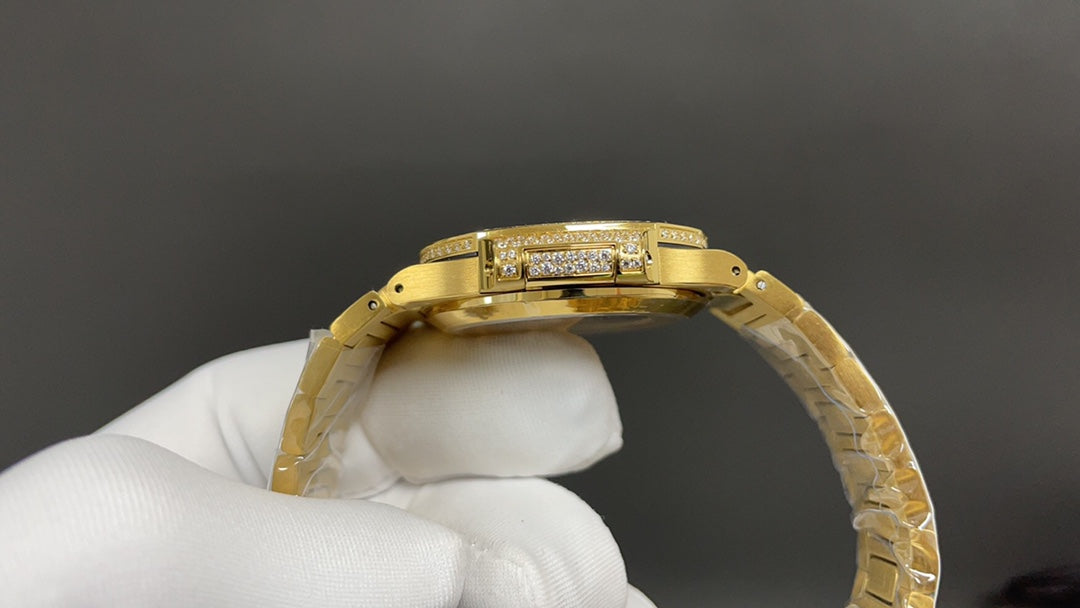 Patek Philippe Nautilus 7010 – “Gold Iced Out” (aftermarket).