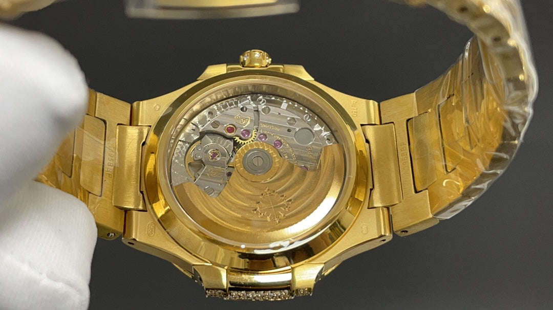 Patek Philippe Nautilus 7010 – “Gold Iced Out” (aftermarket).